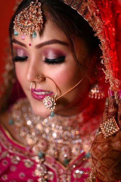 Bride in red lehenga with nath