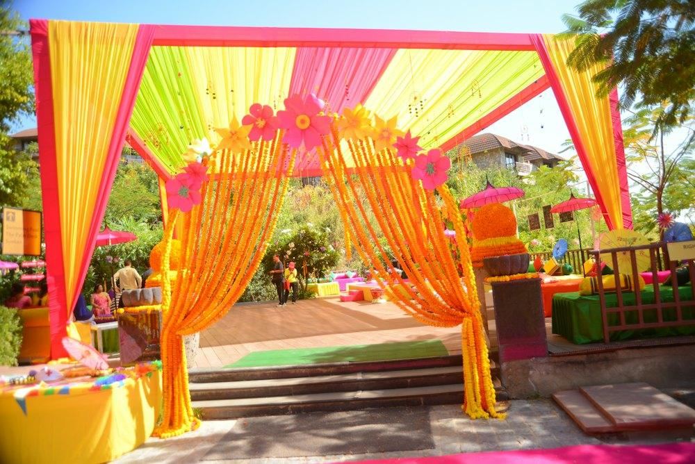 Colourful mehendi decor with drapes