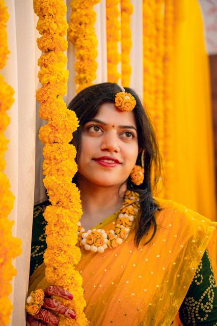 Bride in yellow at her haldi