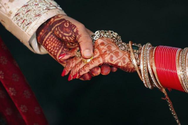 Hands with mehendi held together