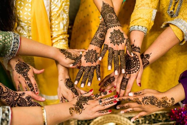 Friends showing mehendi designs